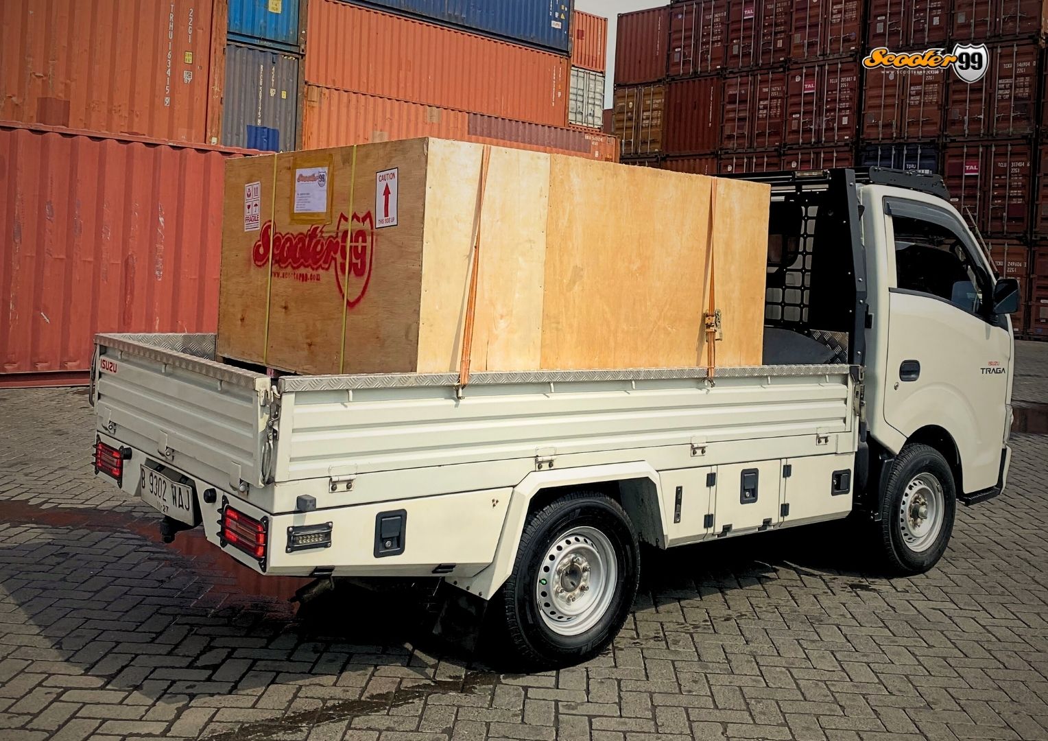 Towing truck in action, securing a vehicle on the roadside